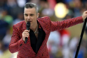 Robbie Williams retorna ao Brasil e quer mostrar que é o 'mestre do entretenimento'